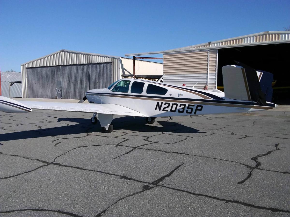 Piper Seminole in red and white with checked wingtips